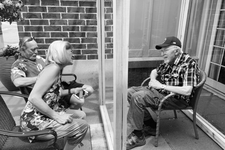 Senior living, senior housing, man and woman visiting elderly man