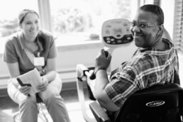 female nurse and Diverse mature adult on work out machine