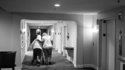 Two women walking down hallway