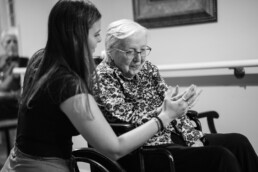 Nurse, care giver with elderly woman in wheelchair