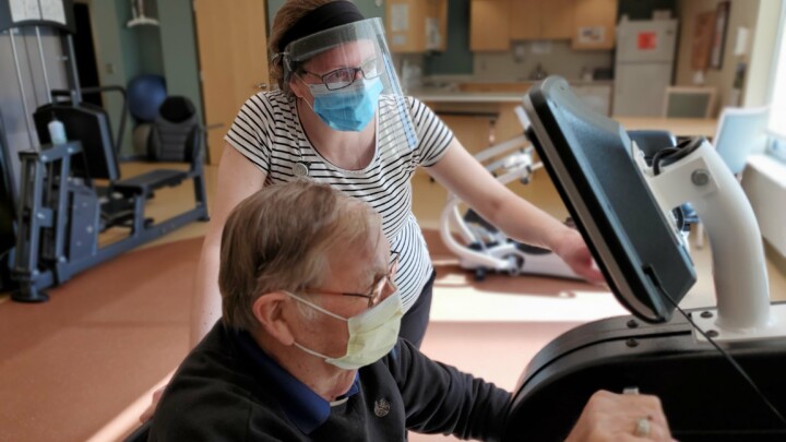 physical therapy, therapy center, female physical therapist working with senior male