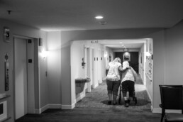 Two women walking down hallway