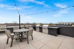 rooftop terrace with patio lights, grill and gas firepit